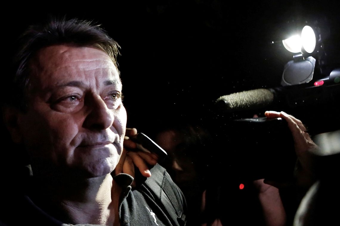 FILE PHOTO: Italian former leftist guerrilla Cesare Battisti leaves the headquarters of the Federal Police in Sao Paulo March 13, 2015. REUTERS/Nacho Doce/File Photo